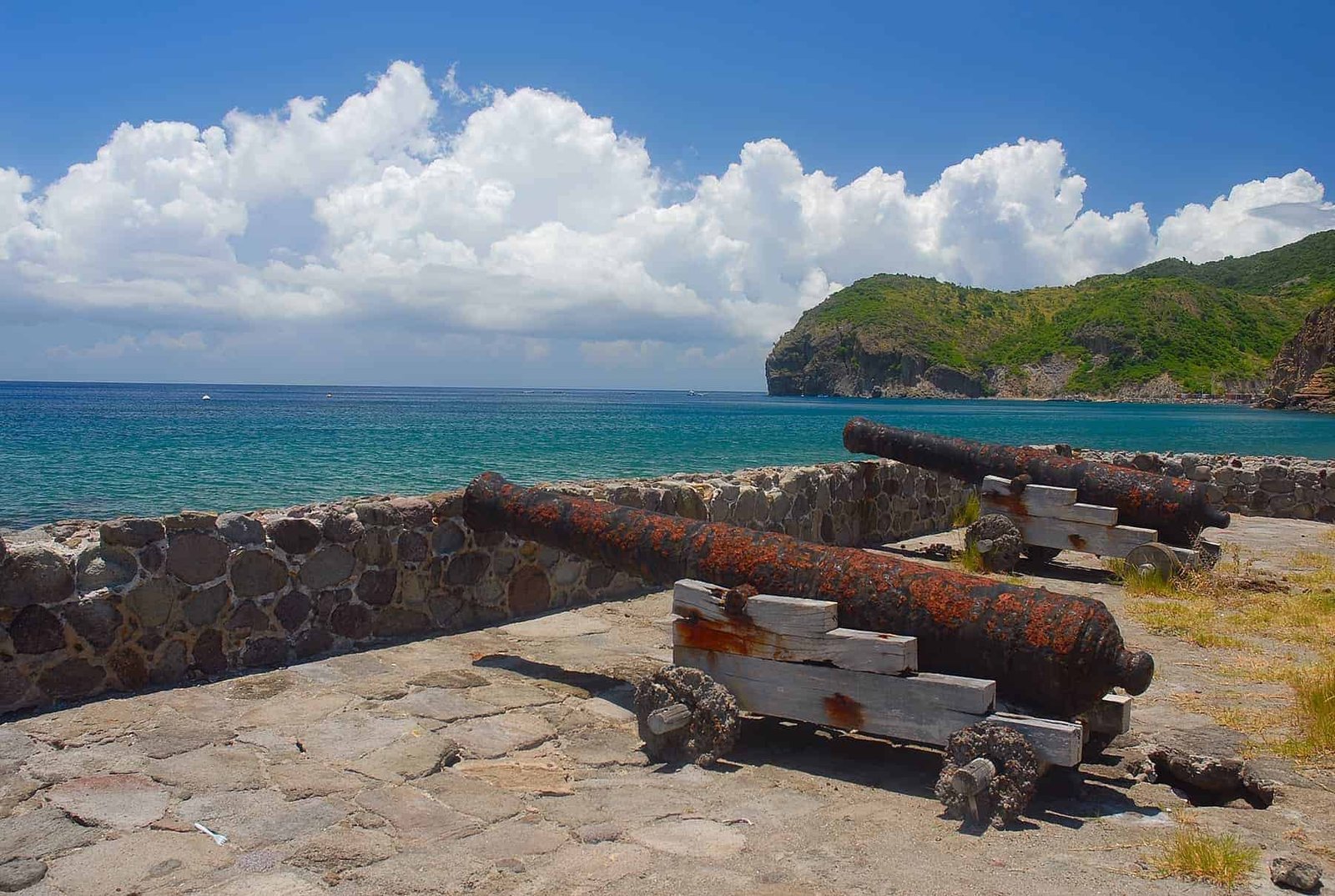 The cannons at Carrs Bay on the Caribbean island of Montserrat in the West Indies. Several cannons are aimed towards the smaller island of Redonda at the remnants of a fort which stood guard over Montserrat centuries ago.