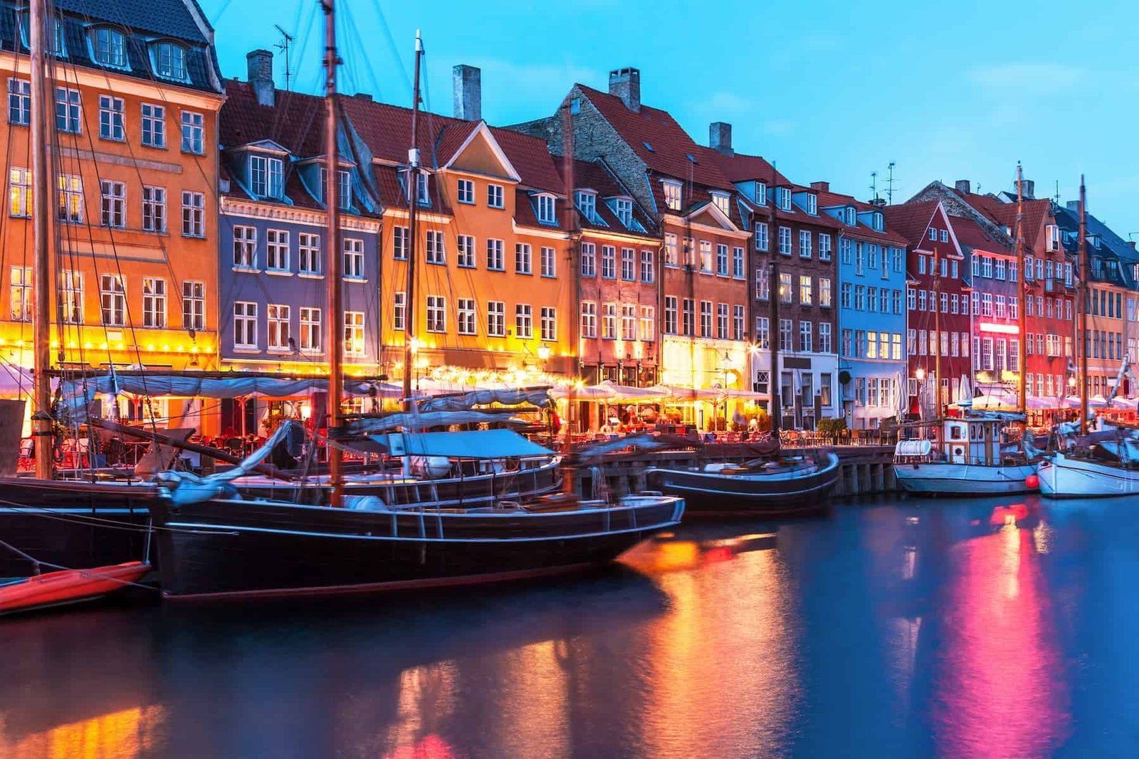 Scenic evening panorama of Nyhavn pier and architecture in the Old part of Copenhagen, Denmark