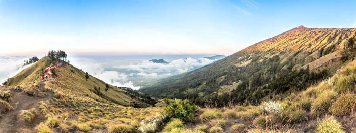 Lombok, Panorama mountain view above the cloud and blue sky. Rinjani mountain, Lombok island, Indonesia