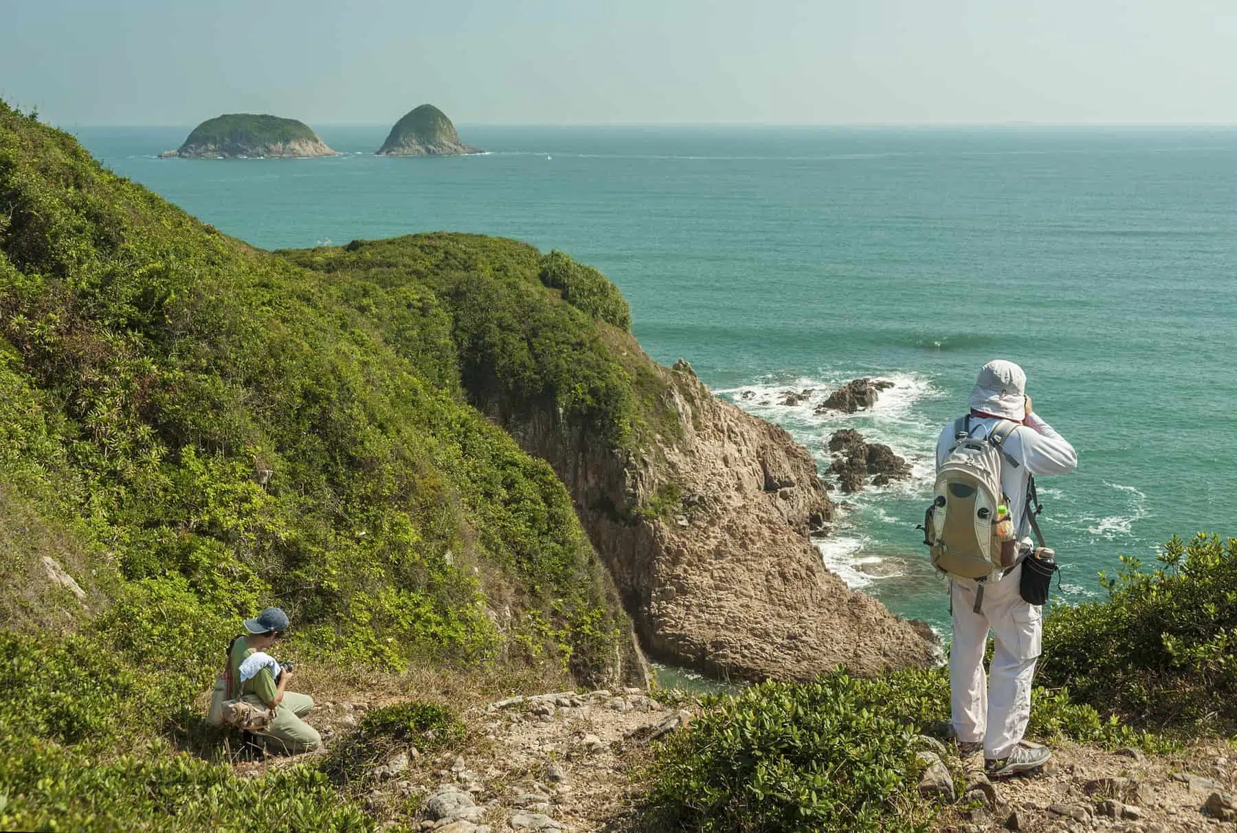 take walk wild side — Tourist taking photo in Hong Kong global geopark of china. Sai Kung District, New Territories.