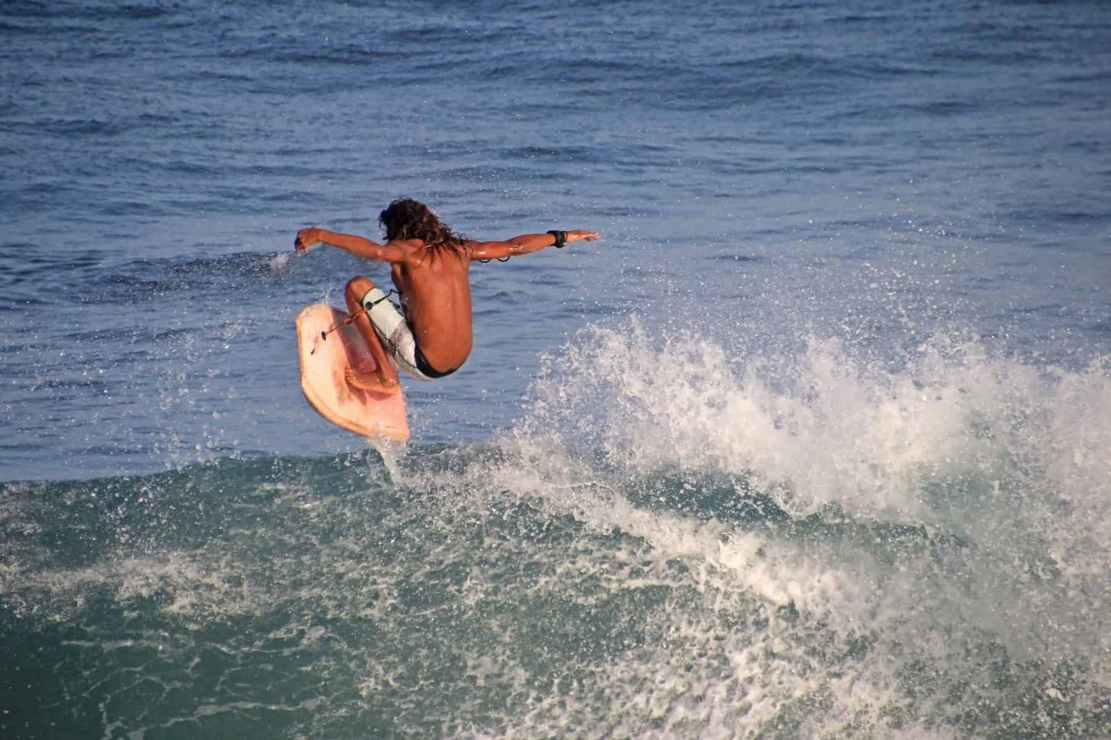 Matchless boogie boarder standing on the board and surfing, El Zonte beach, El Salvador, Central America