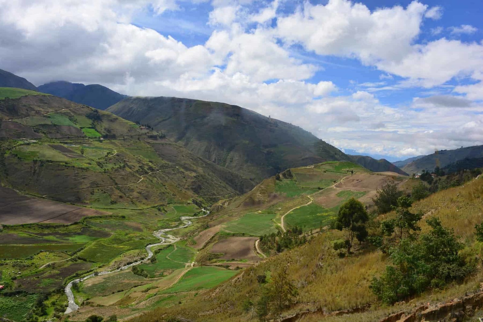 Majestic mountain with waterfall and lush greenery, perfect for nature travel adventures.
