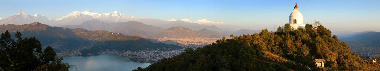 Evening panoramic view of world peace stupa, Phewa lake, Pokhara and great himalayan range, Annapurna, Manaslu, Nepal Himalayas mountains