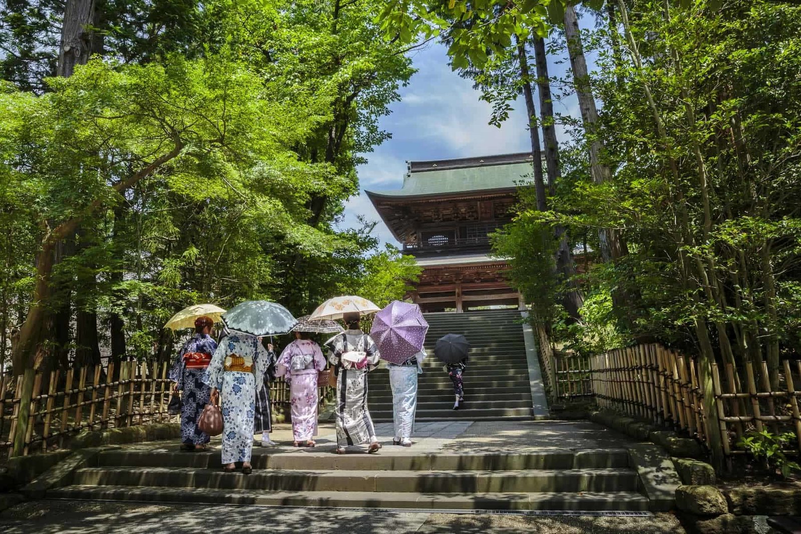 Women in traditional kimonos in front of a temple in Kamakura, Kanagawa prefecture, Japan.
