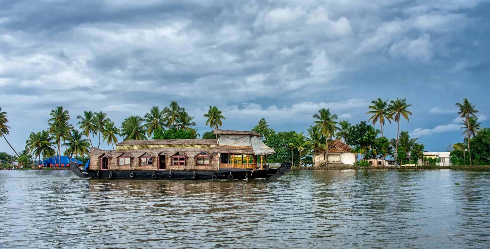 Traditional Indian houseboat near Alleppey on Kerala backwaters, India. Panoramic view