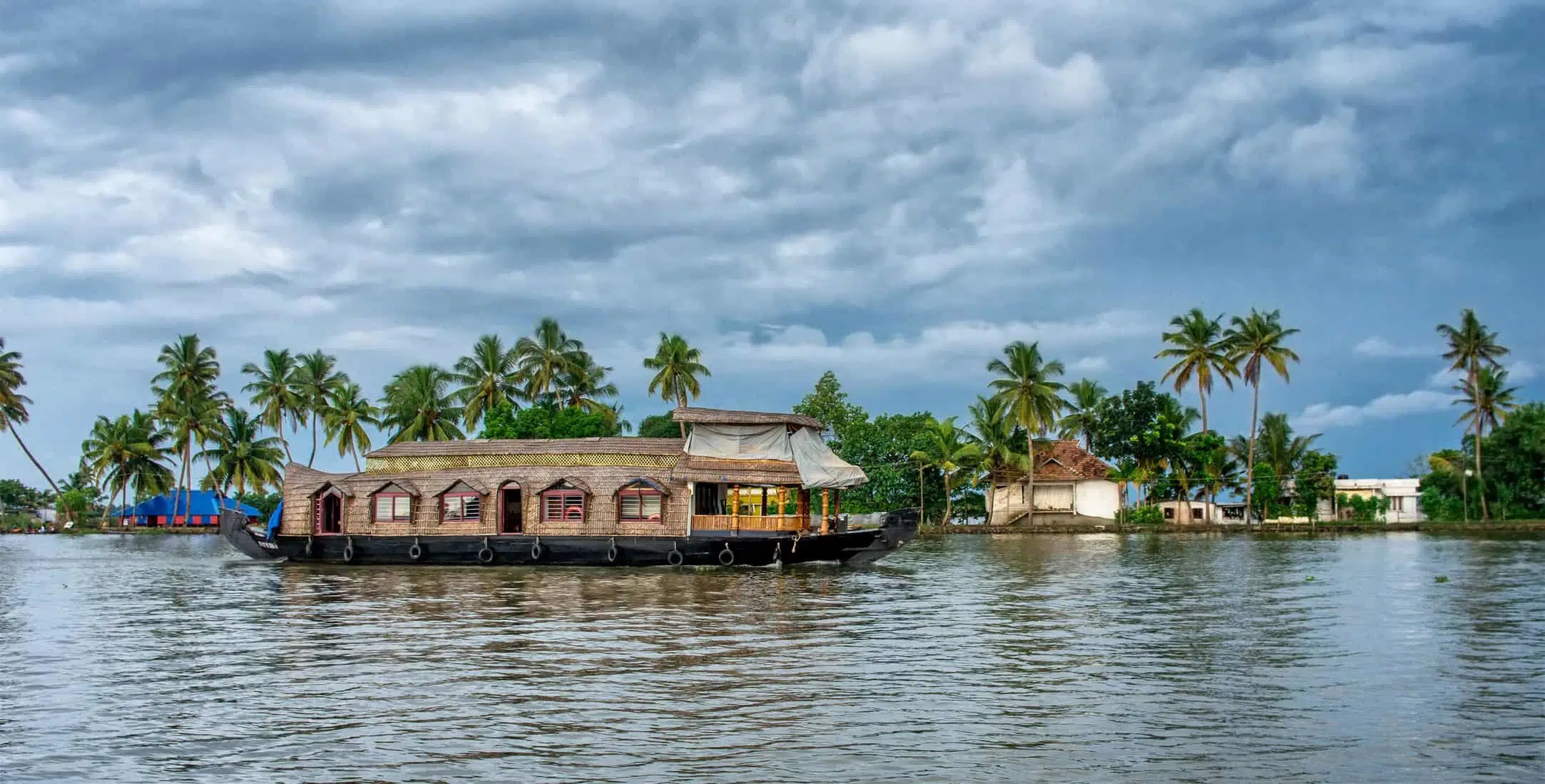 Traditional Indian houseboat near Alleppey on Kerala backwaters, India. Panoramic view