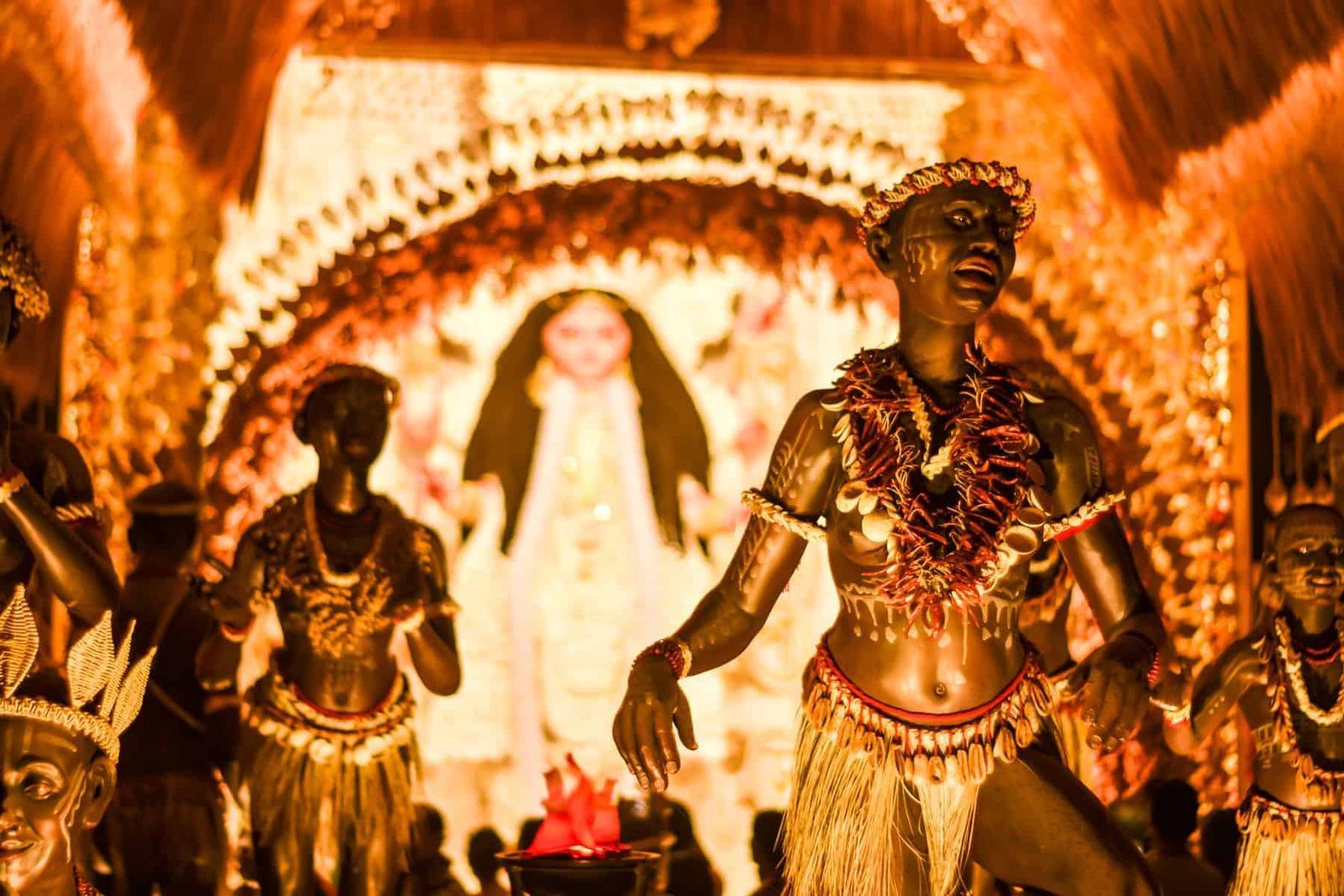KOLKATA , INDIA SEPTEMBER 26, 2017 - Decorated art and craft sculptures of Traditional tribal Santal or Santhal ethnic group dancers wear traditional clothing in a famous Durga Puja pandal.