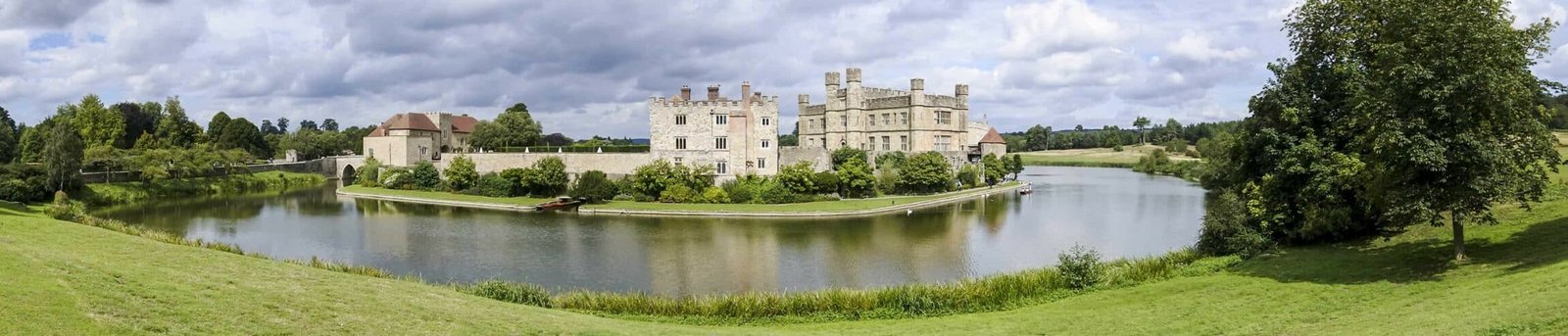 LEEDS CASTLE - Panorama of Leeds castle with the moat in the foreground