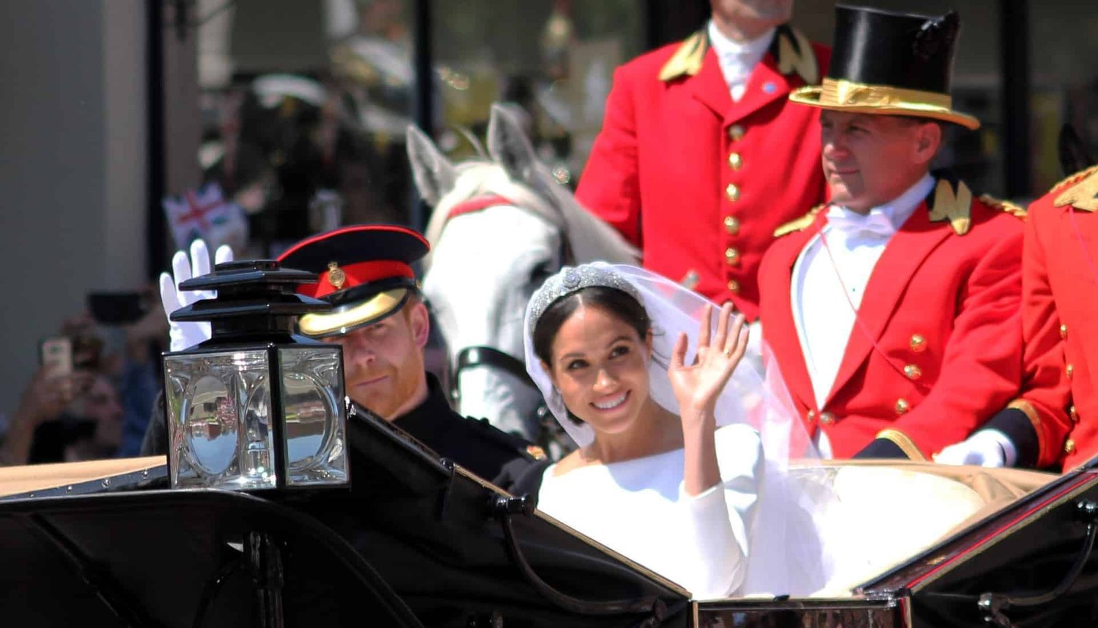 Prince Harry & Meghan Markle, Windsor, Uk - 19/5/2018: Prince Harry and Meghan Markle wedding procession through streets of Windsor then back the Windsor Castle Meghan waving to crowd in Givenchy dress.