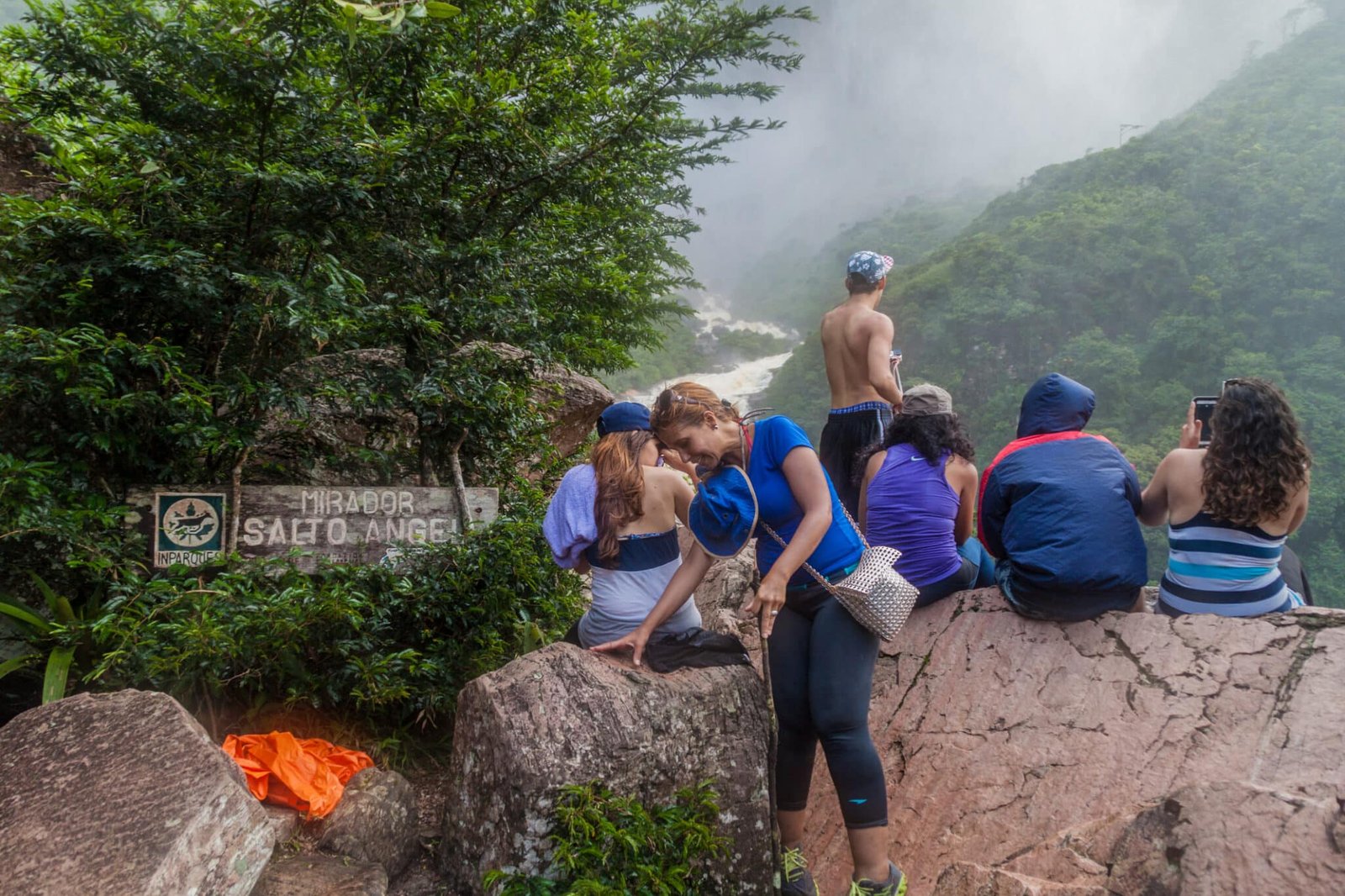 Majestic mountain with waterfall and lush greenery, perfect for nature travel adventures.