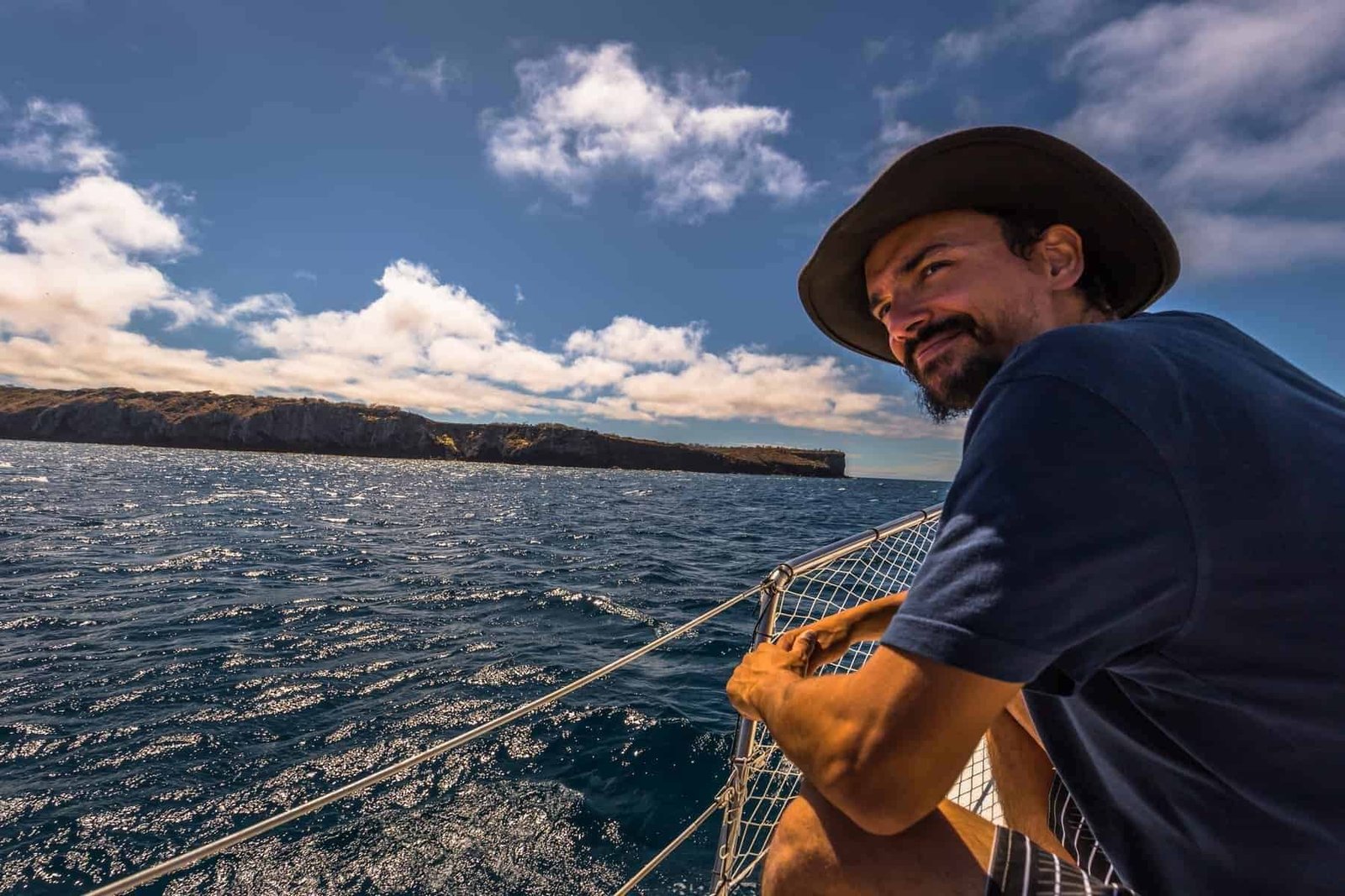 Galapagos Islands - August 24, 2017: Boat riding on the coast of Santa Cruz island, Galapagos Islands, Ecuador.