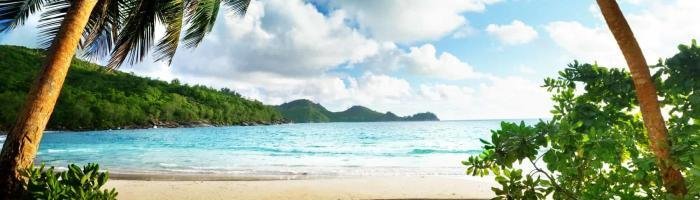 Seychelles beach and wooden pier