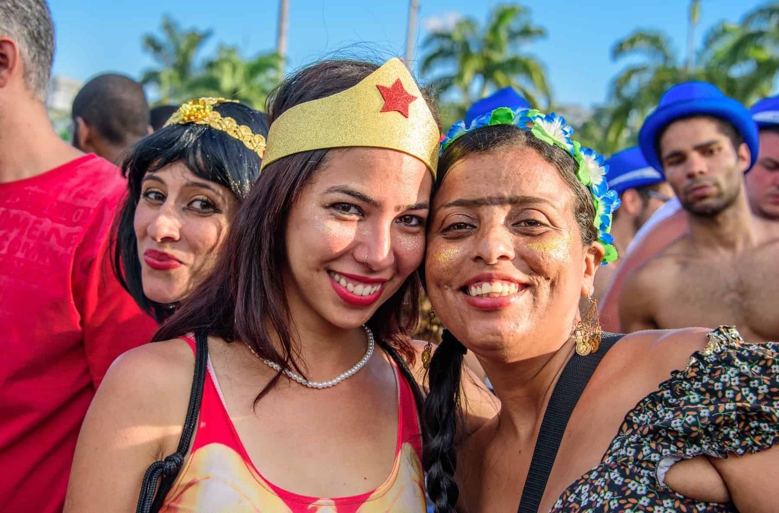 RIO DE JANEIRO, BRAZIL Young women wearing costumes of Wonder Woman and Frida Kahlo with unibrow having fun at Bloco Orquestra Voadora in Flamengo Park, Carnaval 2017