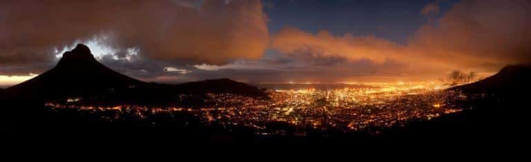 Panoramic night view of Cape Town (South Africa) with the Lions Head Mountain on the left.