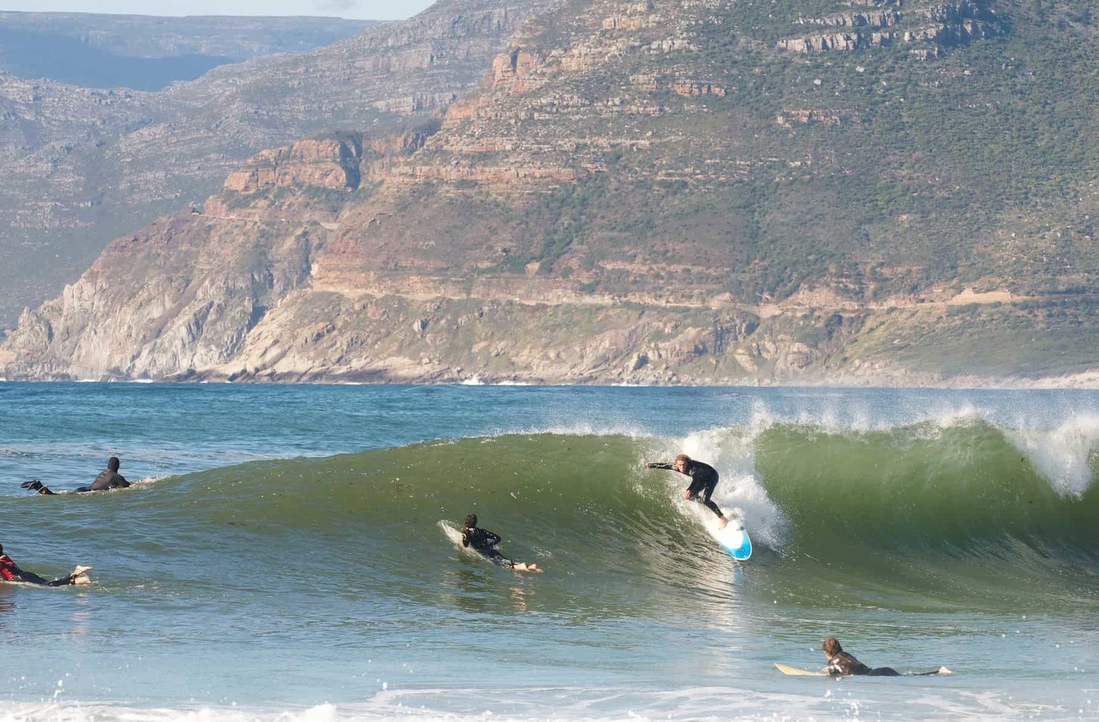 Surfer at popular surfing break,Long Beach, Kommetjie,Cape Town