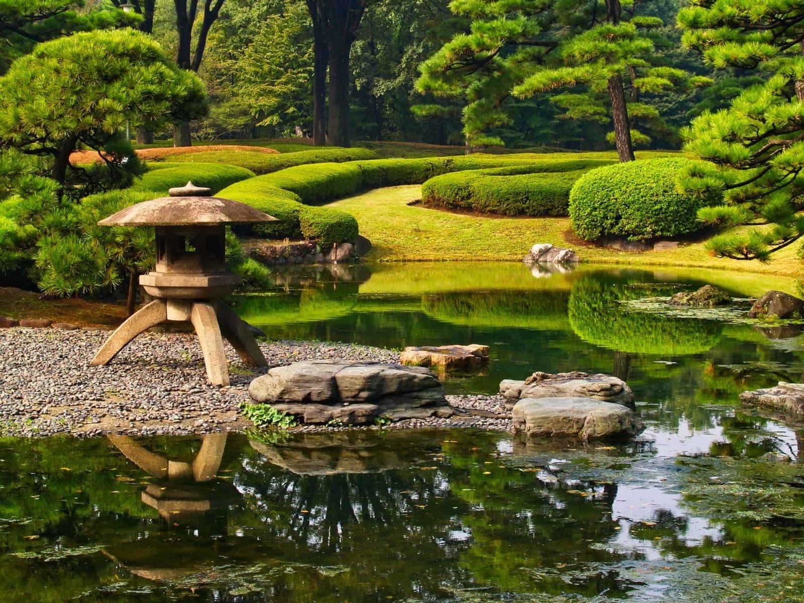Traditional Japanese formal gardens, including water feature, sculptured trees and hedges, Imperial Palace Gardens,Kōkyo Higashi-gyoen, Tokyo, Japan.