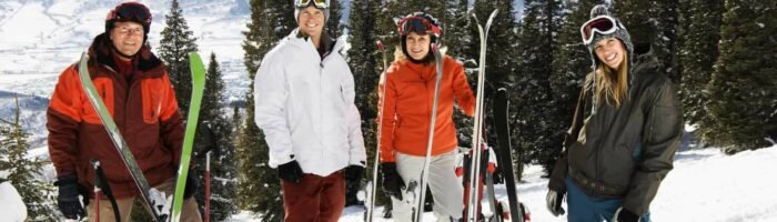 Best Ski resorts in the USA Skiers Standing in Snow Smiling