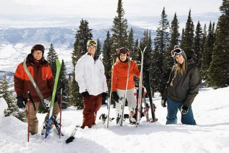 Best Ski resorts in the USA Skiers Standing in Snow Smiling