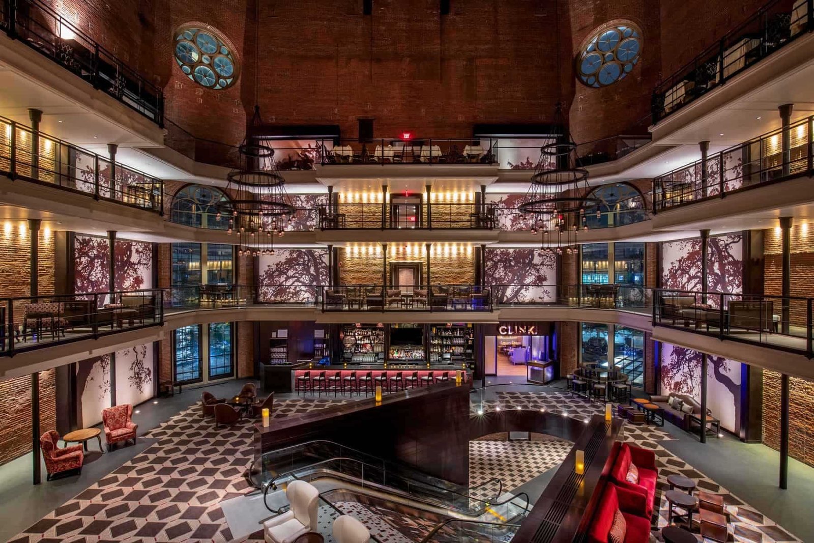 Luxury hotel lobby with modern design, elegant lighting, and spacious seating areas.