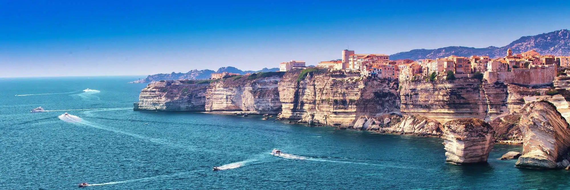 Bonifacio town on beautiful white rock cliff with sea bay, Corsica, France, Europe.