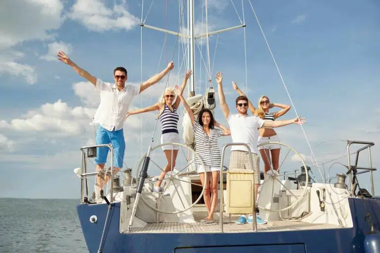 Sailing vacation in the Carribean smiling people onboard a yacht