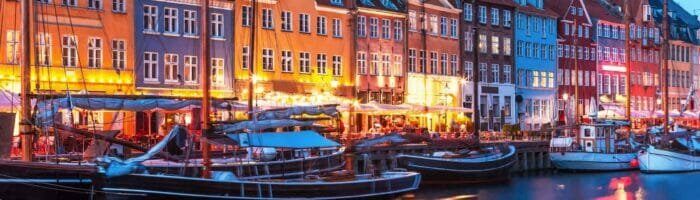 Scenic evening panorama of Nyhavn pier and architecture in the Old part of Copenhagen, Denmark