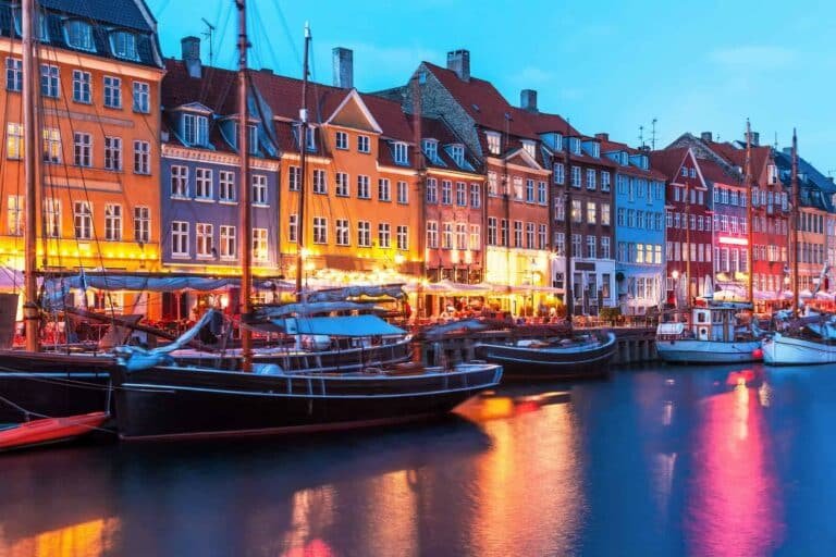 Scenic evening panorama of Nyhavn pier and architecture in the Old part of Copenhagen, Denmark