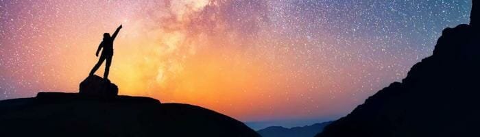 Vast starry night sky over mountain silhouette, stargazing, adventure, travel, nature, outdoor exploration, scenic landscape.