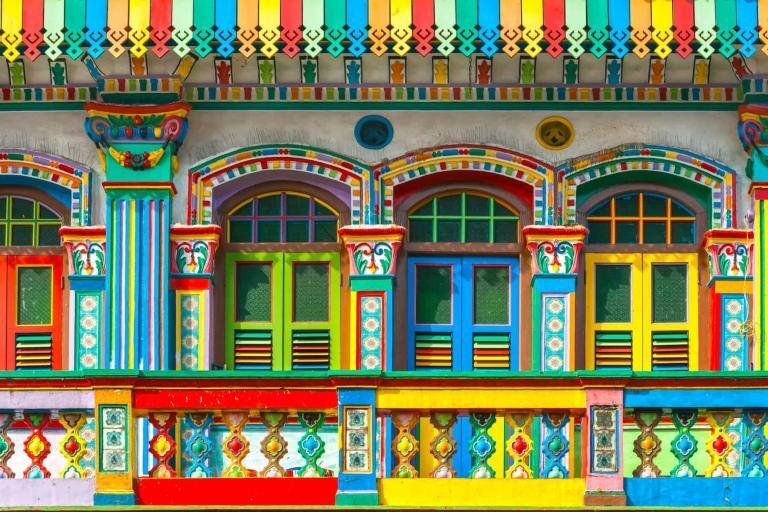 Vibrant colorful house exterior with intricate Mexican folk art design and architecture.