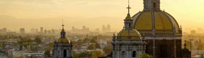 Spanish speaking countries.Scenic view at Basilica of Guadalupe with Mexico city skyline at sunset, Mexico