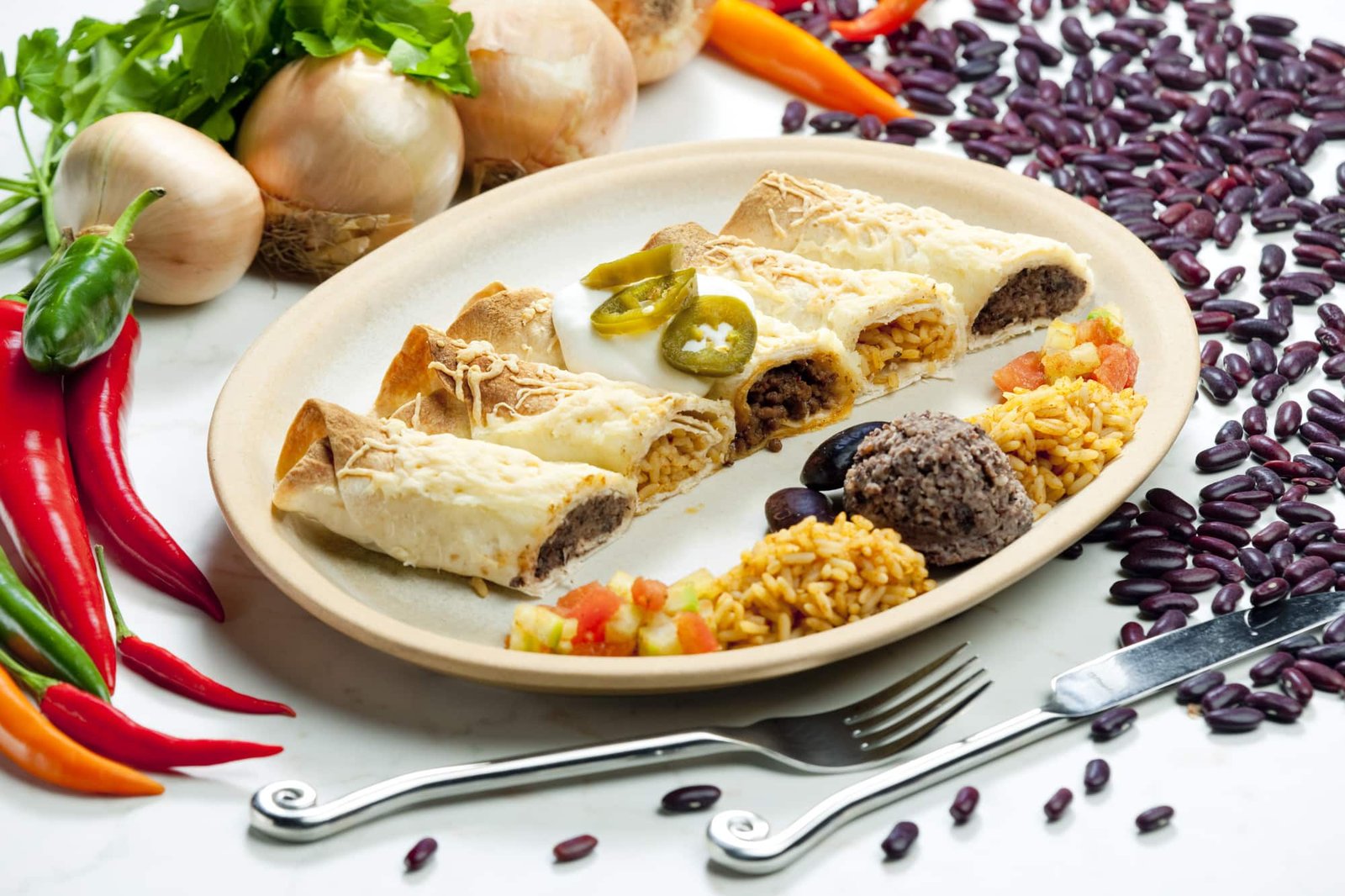 Scented couscous with dried fruits, cinnamon sticks, and star anise in traditional Moroccan pottery.