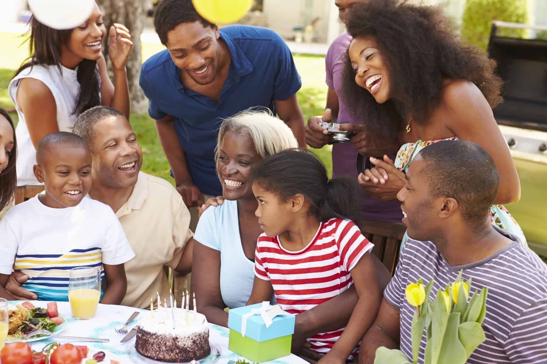 Multi Generation Family Celebrating Birthday In Garden