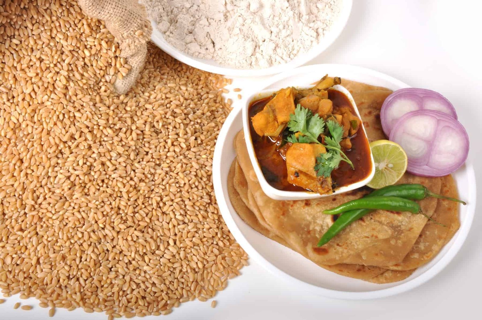 Spicy Indonesian lontong with various side dishes on a wooden table, traditional festive Indonesian cuisine.