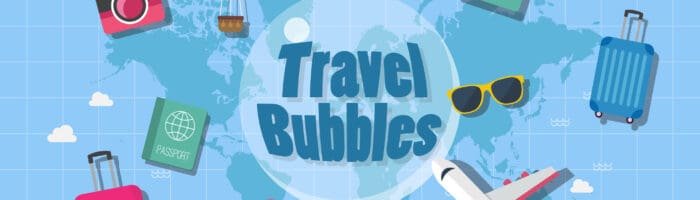 Colorful travel icons with suitcase, airplane, camera, and map on world map background for travel blog.