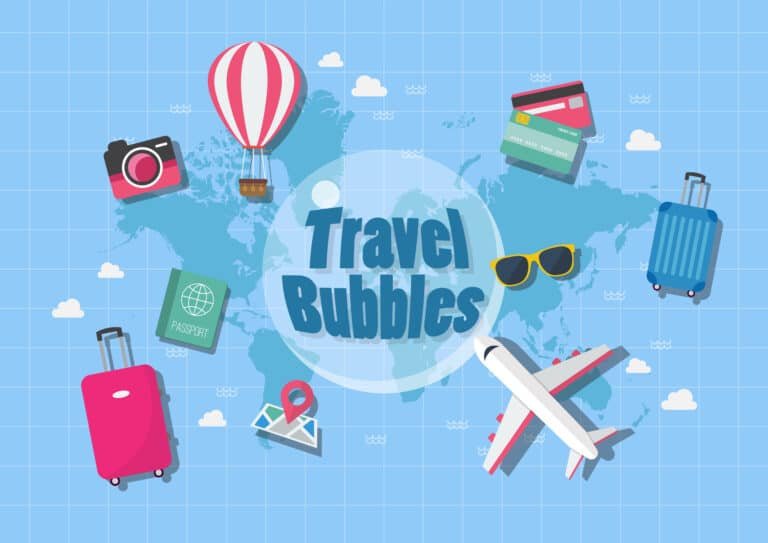 Colorful travel icons with suitcase, airplane, camera, and map on world map background for travel blog.