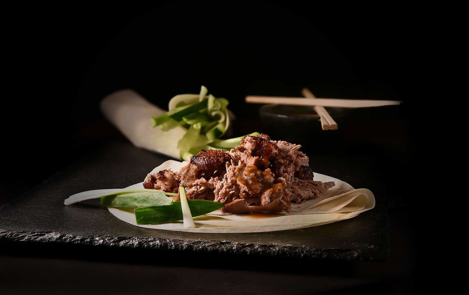 Vibrant prayer flags with Mount Everest in the background showcasing Himalayan mountain scenery.