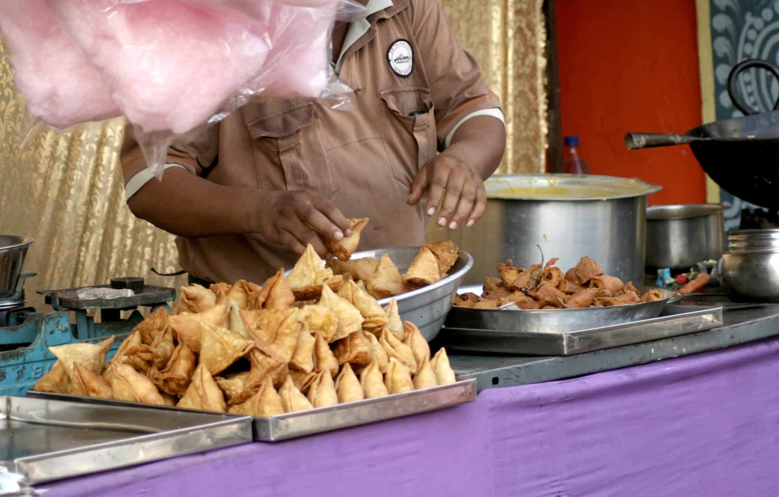 Indian street food vendor preparing and serving famous spicy Chaat in Chandni Chowk, Old Delhi, India