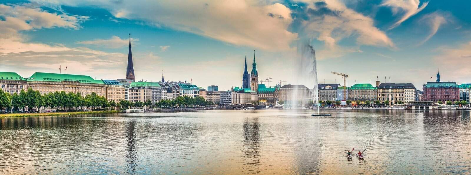 Binnenalster (Inner Alster Lake) in golden evening light at sunset, Hamburg, Germany