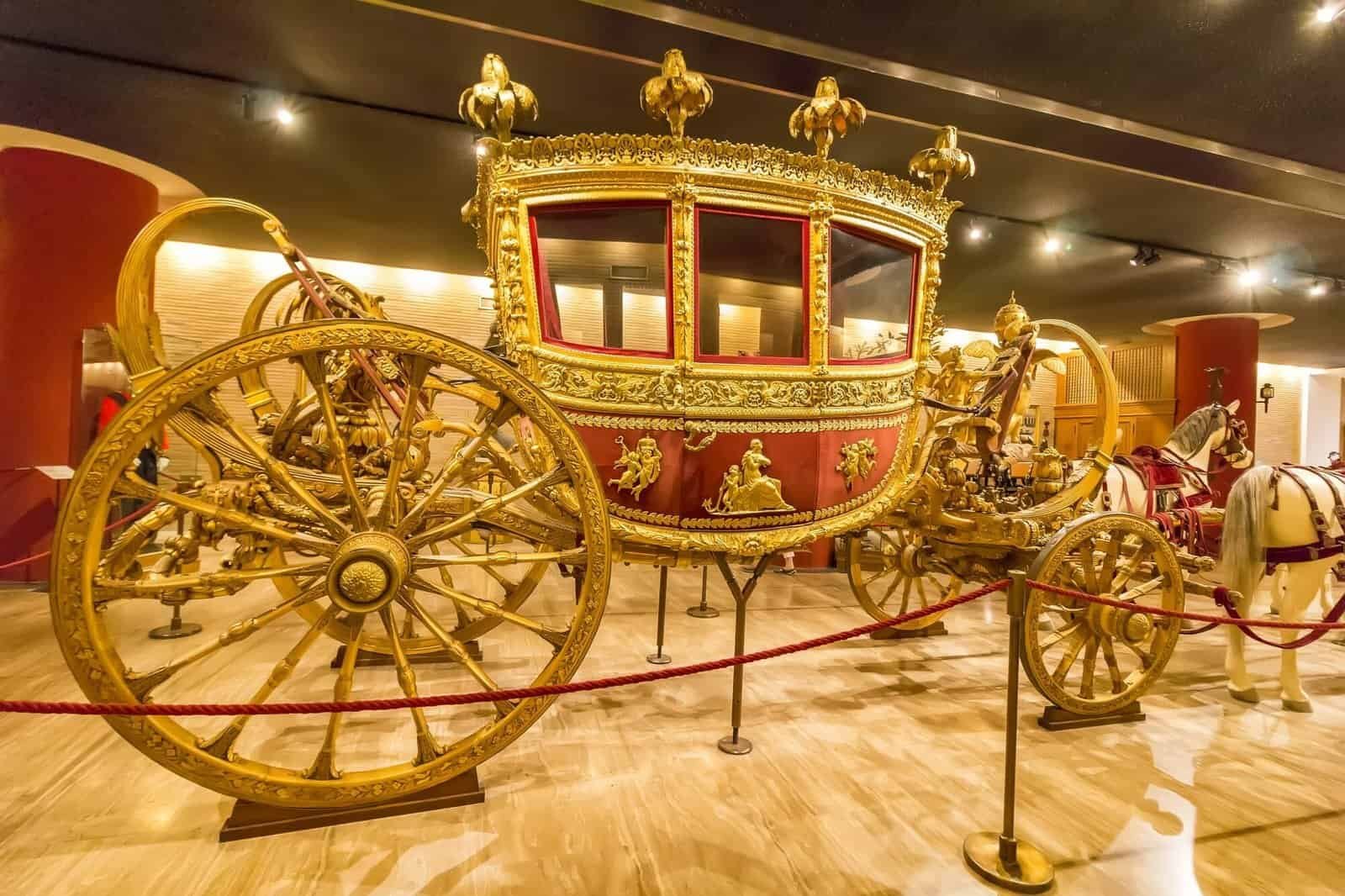 Vatican, Vatican city - Carriage in the Hall of the historic transportation vehicles of the Pope, Vatican Museum. It was established in 1506. Side view