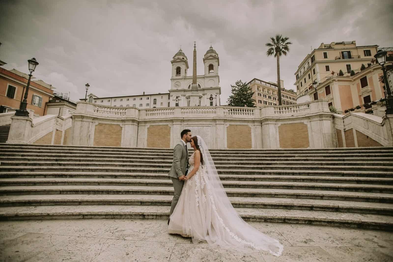 Young wedding couple on Spanish stairs in Rome, Italy