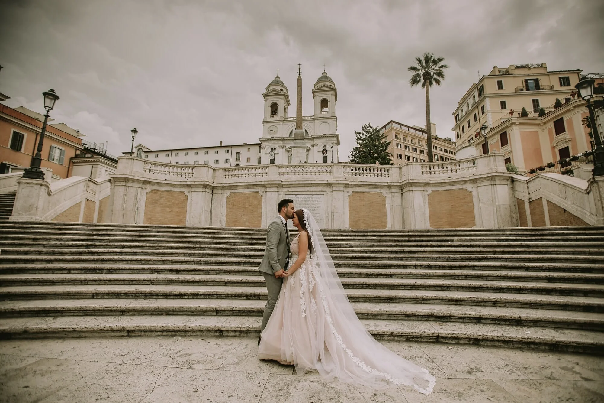 Young wedding couple on Spanish stairs in Rome, Italy