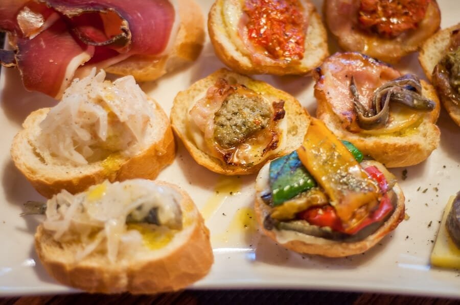 Cicchetti are small snacks served in traditional barscalled bacari in Venice
