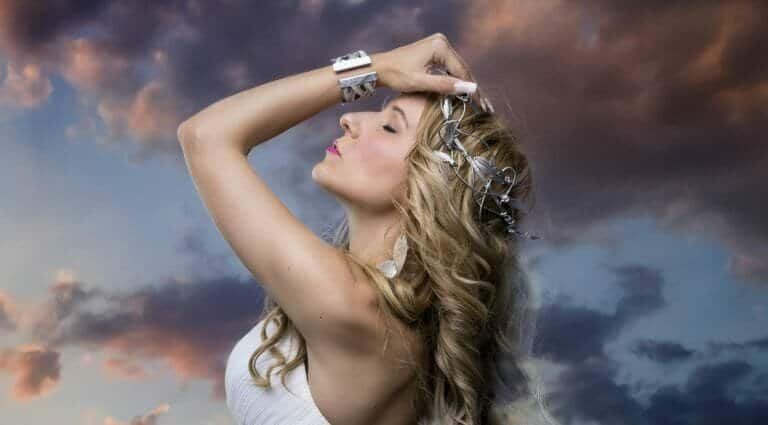 Greek goddess, blond woman with silver laurel wreath dressed in