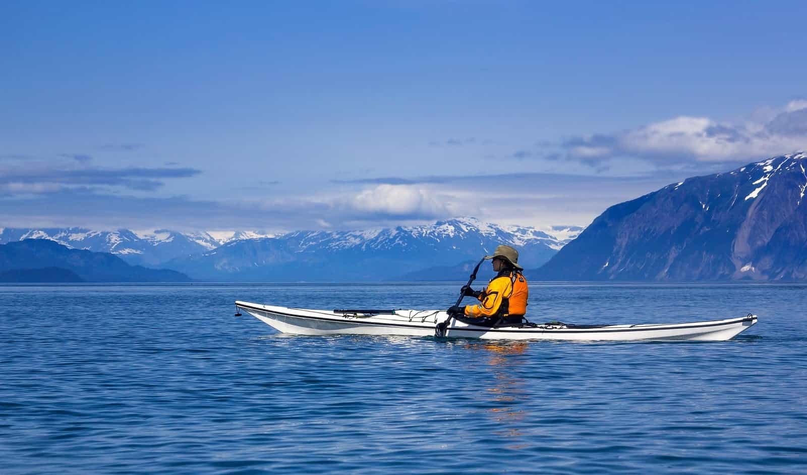 Female kayaker paddling in Glacier Bay National Park, Alaska