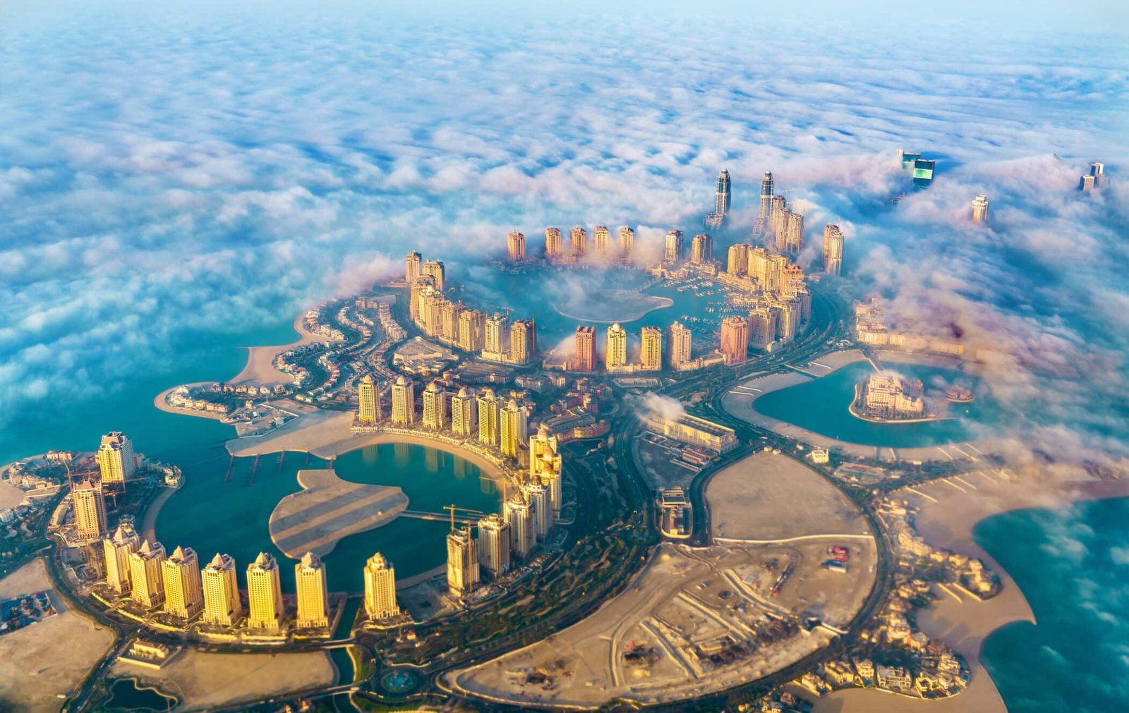 Pearl-Qatar island in Doha through the morning fog. Qatar, the Persian Gulf