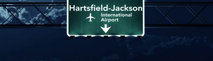The busiest airports. Atlanta USA Airport Highway Sign at Night