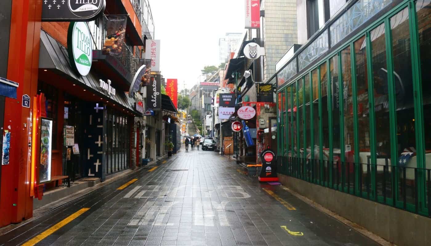 A strip of bars and restaurants in Itaewon during the day
