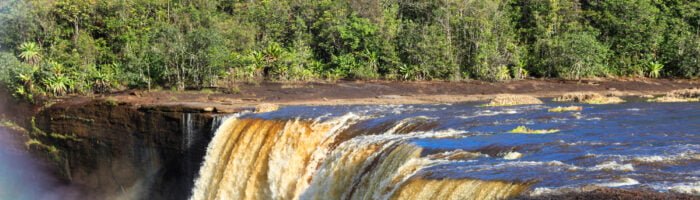 View of The beautiful powerful Kaieteur waterfall on a clear Sunny day against the background of the jungle, the height of the waterfall is 221 meters, Guyana.